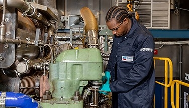Chevron Oronite worker in marine test engine laboratory.